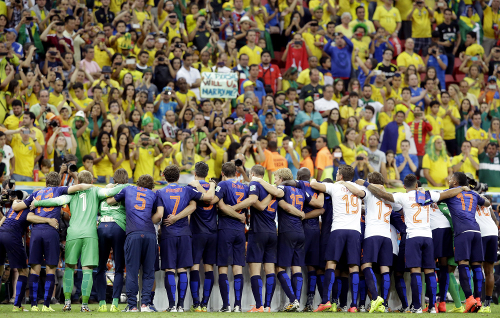 The Dutch team line up for a photo after the World Cup third-place soccer match between Brazil and the Netherlands at the Estadio Nacional in Brasilia, Brazil, Saturday.