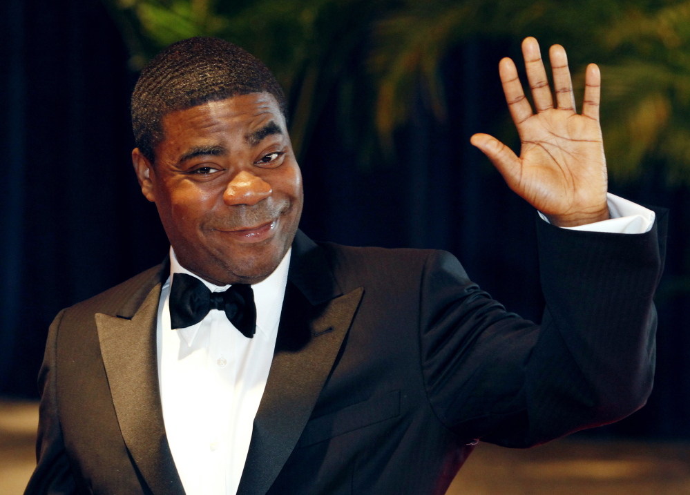 Comedian Tracy Morgan is suing Wal-Mart after a driver of one of its trucks slammed into his limo van on June 7. Morgan, shown in 2010, is still recovering from a traumatic brain injury he suffered, his lawyer says.
