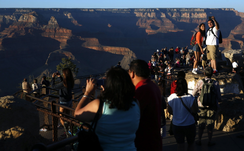 Visitors take in the view of the Grand Canyon at Mather Point on the Southern Rim of Grand Canyon National Park in January. The vista could be changed forever if developers build in this area.