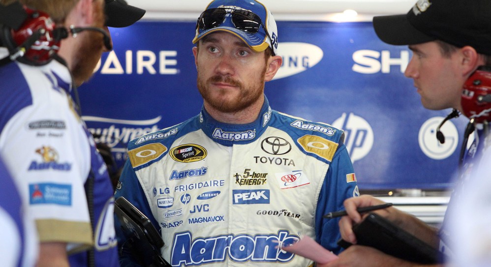 Brian Vickers, who has had heart surgery to prevent blood clots, talks with his crew after the Saturday morning practice for Sunday’s Sprint Cup Series at New Hampshire Motor Speedway in Loudon, N.H.