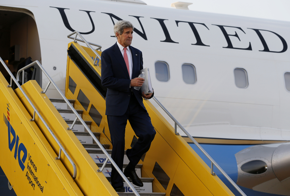 U.S. Secretary of State John Kerry steps out his plane upon arrival at Vienna International Airport for talks with foreign ministers from the six nations negotiating with Tehran on its nuclear program in  Vienna, Sunday.