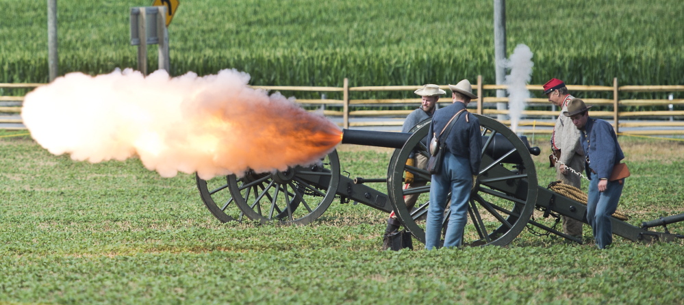 Civil War re-enactors fire an artillery blast at the Monocacy National Battlefield near Fredrick, Md., last week. Keene State College students are transcribing 144 letters written by Pvt. Willard Templeton as he traveled and fought with the 11th New Hampshire Regiment.