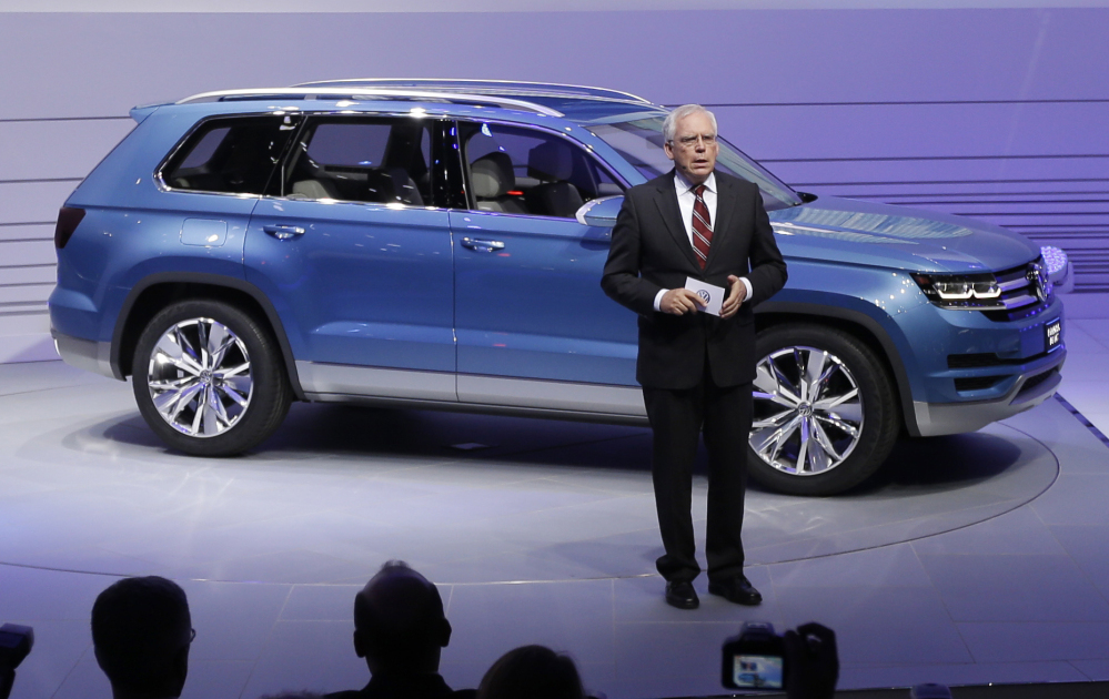 In this Jan. 14, 2013 file photo, Ulrich Hackenberg, Volkswagen Director of Produce Development for Power Trains, stands next to the Volkswagen CrossBlue SUV concept vehicle during the North American International Auto Show in Detroit.