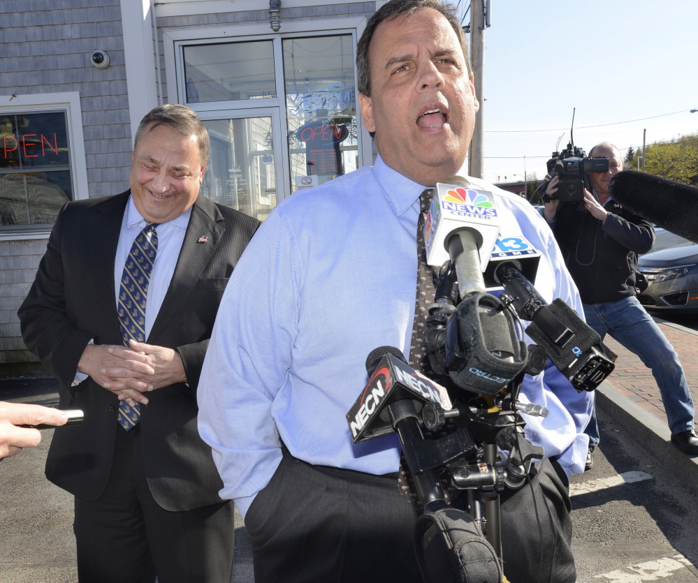 Comments by New Jersey Gov. Chris Christie, the head of the Republican Governors Association, get a laugh from Gov. Paul LePage during a campaign stop in May at Becky’s Diner in Portland.  “We’re going to be spending a lot of ... resources here,” Christie said.