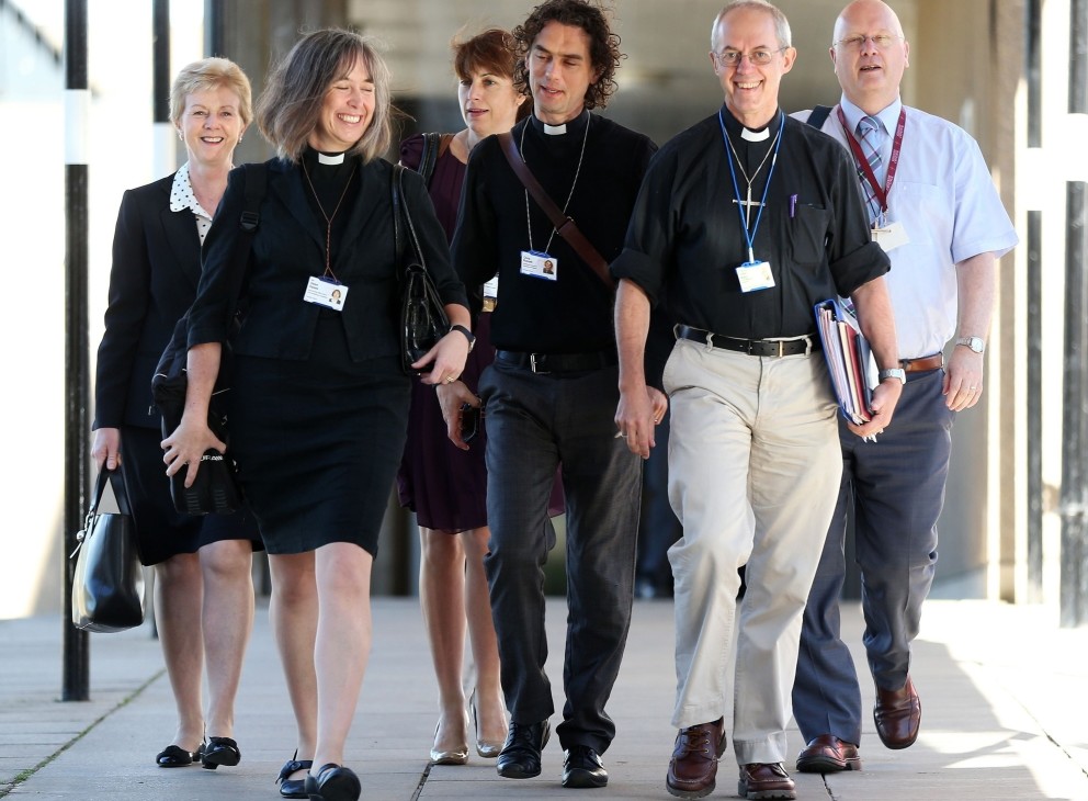 The Archbishop of Canterbury, Justin Welby, second from right, and unidentified members of the clergy arrive for the General Synod meeting at The University of York, in York, England, on Monday.