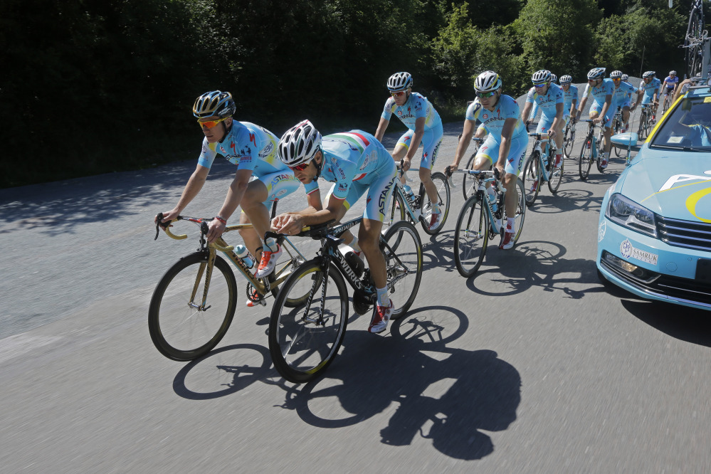 The Associated Press
Overall leader Vincenzo Nibali of Italy, right, rides with general manager and former cyclist Alexandr Vinokurov, left, during a training near Besancon, eastern France, Tuesday.
