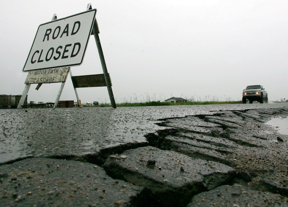 A sign warns that a damaged road is closed. The Highway Trust Fund has been on the edge of bankruptcy since 2008.