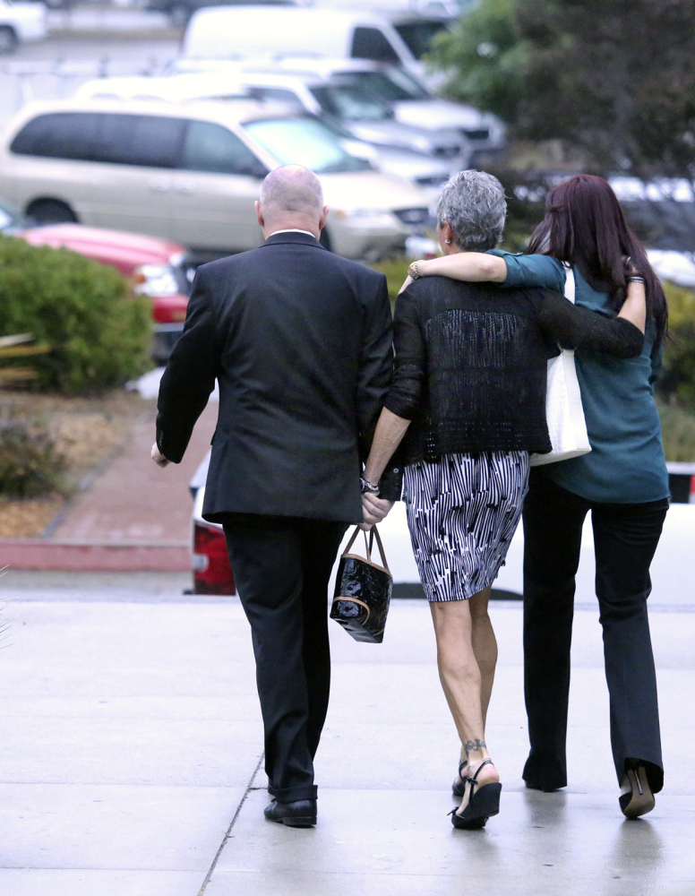 Alix Tichelman’s parents, Bart and Leslie Tichelman, and her sister Monica Tichelman, right, leave Santa Cruz Superior Court after Alix Tichelmans’s arraignment on Wednesday.