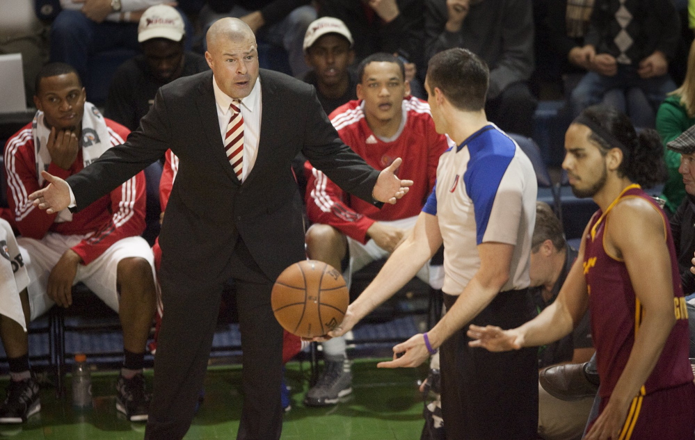 Former Maine Red Claws head coach Mike Taylor argues with the ref over an out of bounds call during the second quarter of a game against  the Canton Charge in D League action at the Expo on March 8, 2013.