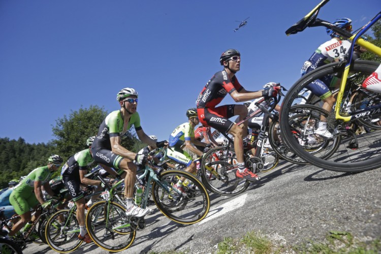 Tejay van Garderen of the U.S., center right ion black and red jersey, and Netherland’s Bauke Mollema, center left in green and black jersey, climb during the eleventh stage of the Tour de France cycling race over 187.5 kilometers (116.5 miles) with start in Besancon and finish in Oyonnax, France, Wednesday.