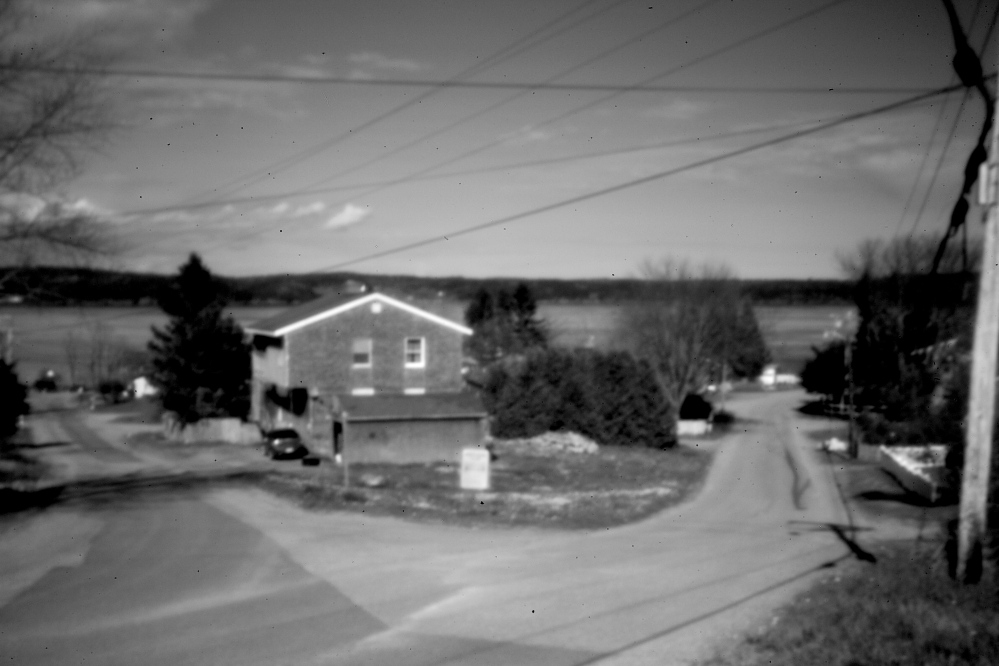 The Pleasant Point reservation is captured in the aperture of a pinhole camera. A legal challenge resulted after an unusual Passamaquoddy caucus initiative in 1986 left many members of the tribe stripped of their right to vote on tribal matters.