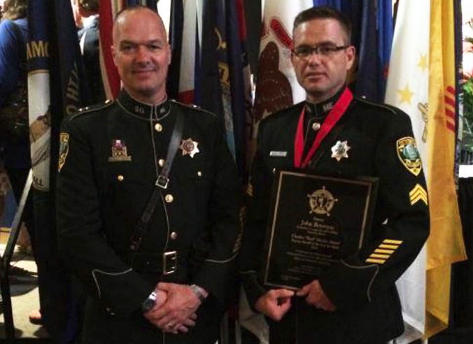 Kennebec County Sheriff Randall Liberty stands with Sgt. John Bourque following the awards ceremony last month in Texas.