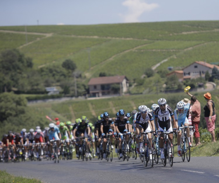 China’s Cheng Ji, front, nicknamed the “breakaway killer,” sets the pace as the pack chases him after a breakaway during the 12th stage of the Tour de France on Thursday in Saint-Etienne, France.