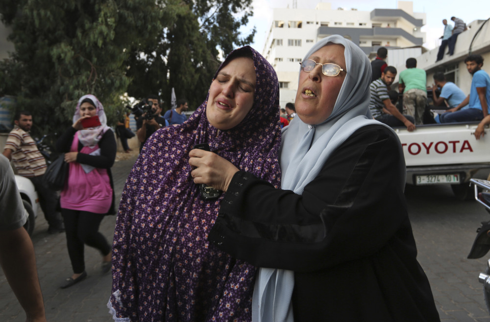 The mother, left, of Fullah Tariq Shahebar, 8, one of three children who were killed in an Israeli missile strike, grieves after identifying her daughter at the hospital’s morgue in Gaza City on Thursday. A State Department spokeswoman said, “Israel must take every possible step to meet its standards for protecting civilians from being killed.”