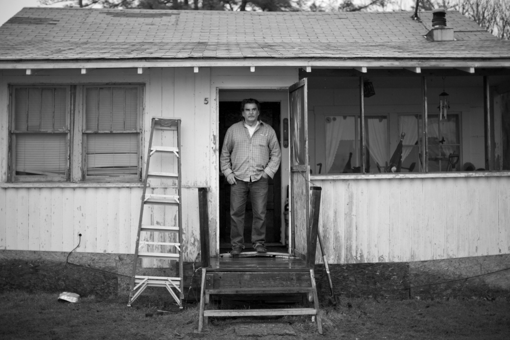 Former tribal Chief Robert Newell stands in the doorway of the seasonal camp he now calls home at Indian Township. Newell spend nearly four years in a Pennsylvania prison after being convicted late in 2008 on 29 counts that included conspiring to defraud the United States, misapplication of federal funds, fraud and lying to federal agencies.