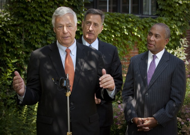 Maine Democratic candidate for governor, U.S. Rep. Mike Michaud, speaks during a news conference at the Cumberland Club in Portland on Monday. Gov. Peter Shumlin of Vermont, center, and Gov. Deval Patrick of Massachusetts, right, came to Maine to lend support.