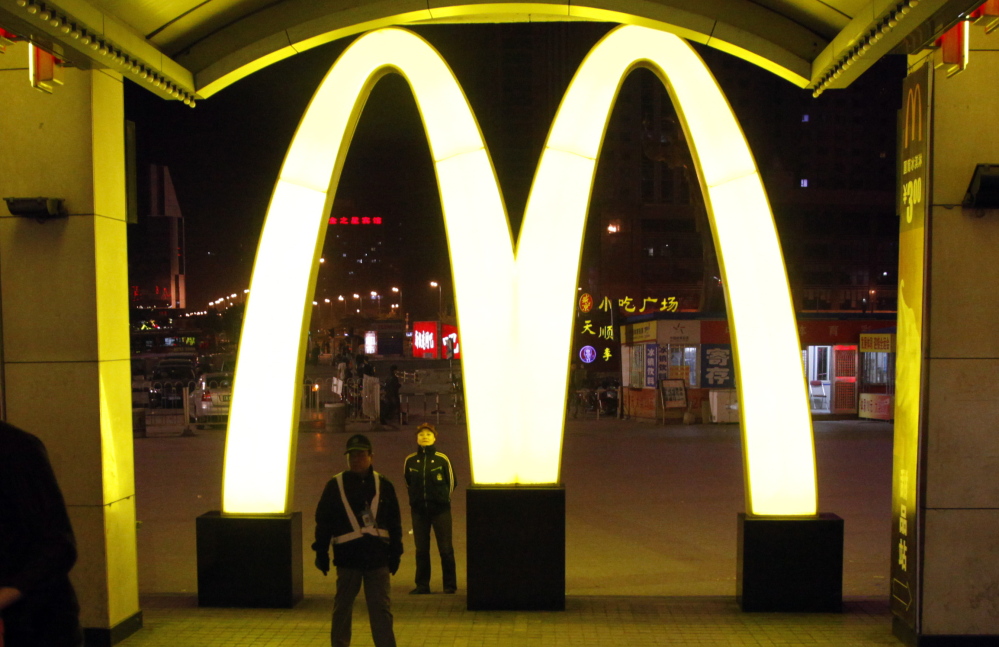 A McDonald’s logo is displayed at a train station in China, where a series of scandals may hurt the fast-food business.