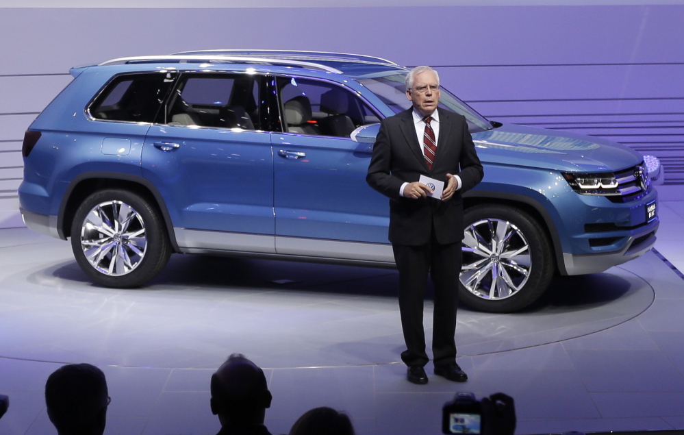 Volkswagen’s Ulrich Hackenberg introduces a Volkswagen CrossBlue SUV concept vehicle in 2013. Automakers including Volkswagen and GM are enticing Americans with ads promising cheap leases.