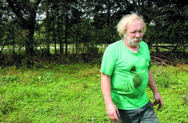 Farmer Mark Gould, seen in this 2011 photo, owns property that abuts Interstate 95 in Sidney.