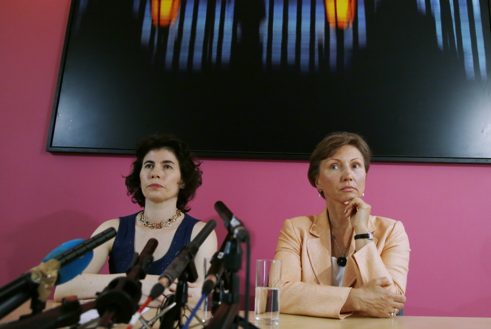 Alexander Litvinenko’s widow, Marina Litvinenko, right, speaks in London in favor of a reopened injury into her husband’s death in 2006. With her is her lawyer Elena Tsirlina.