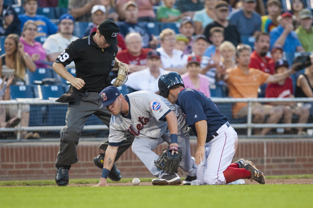 Portland’ Sean Coyle slides safely into Binghamton Mets’ third baseman Dustin Lawley in the fourth inning. Logan Werlinger/Staff Photographer