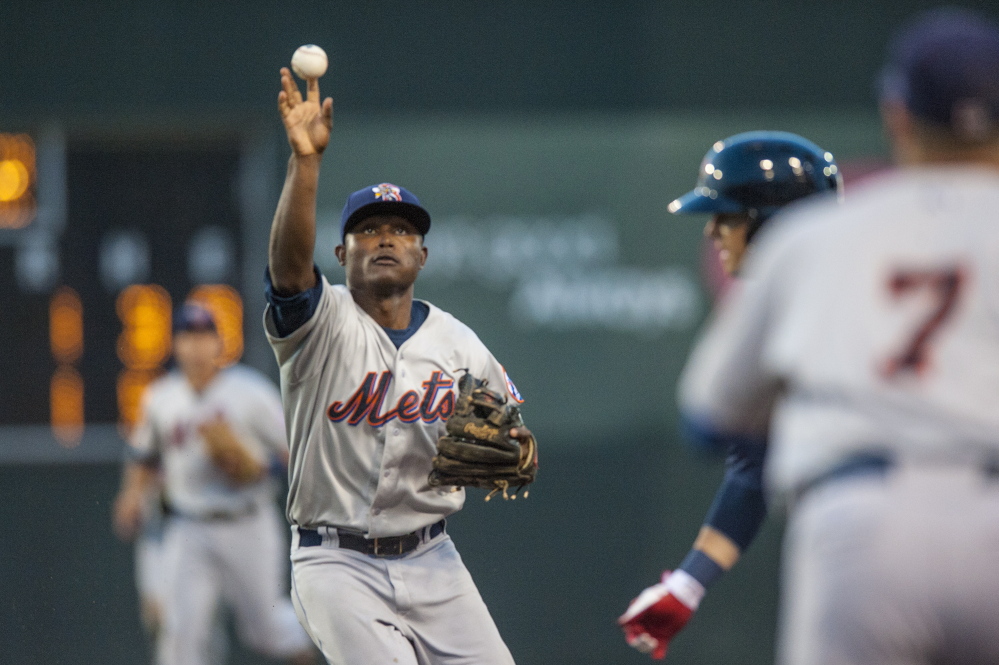 Binghamtom Mets’ second baseman Dilson Herrera makes a throw during a run down involving Portland’s Shannon Wilkerson in the fourth inning Tuesday at Hadlock Field.