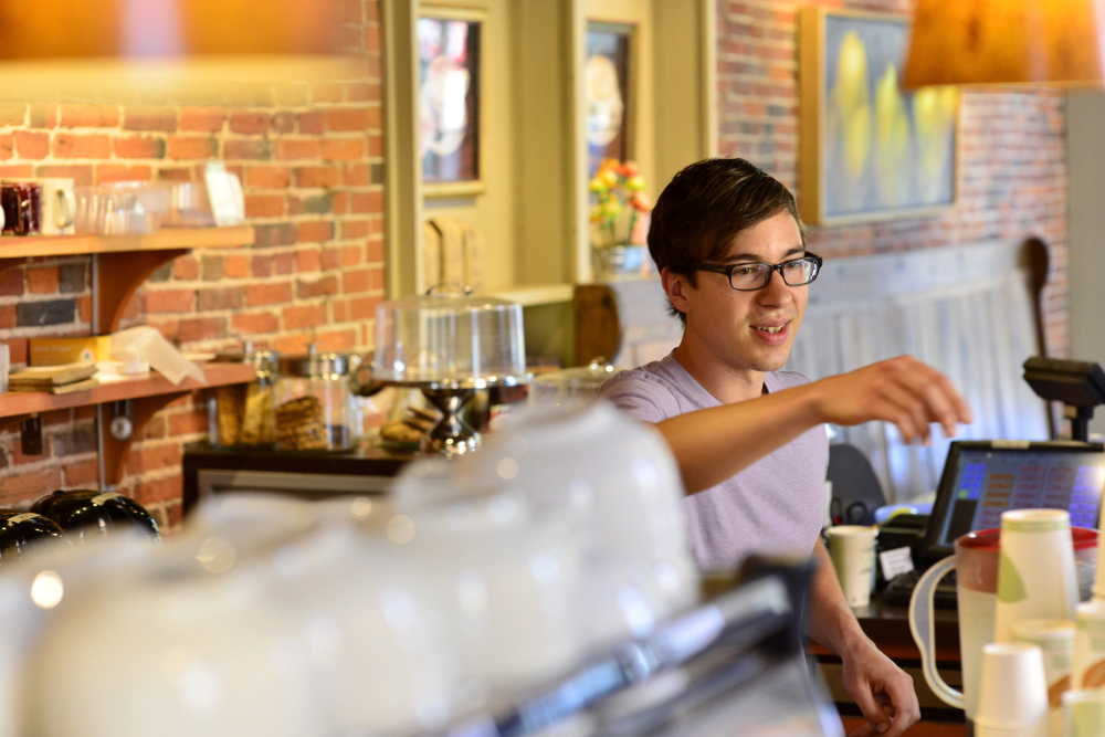 In a 2014 file photograph, Christopher McClure, 26, of Portland works as a barista at Arabica Coffee.