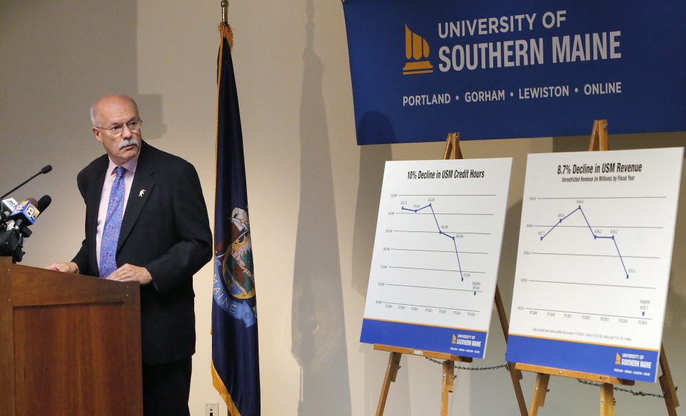 David Flanagan discusses charts that show falling enrollment and declining revenues at USM during a news conference Wednesday at the school. “This university has extraordinary assets ... yet something is seriously wrong here. USM is losing out,” said the former CEO of CMP.