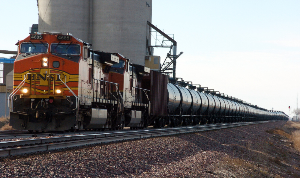 A BNSF Railway train hauls crude oil near Wolf Point, Mont. Older rail tank cars that carry crude oil would be phased out within two years under proposed regulations.