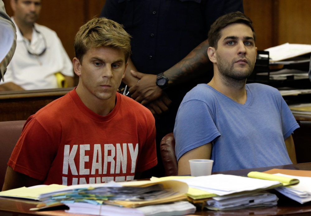 Bryan Caputo, left, and Daniel Petryszyn sit during arraignment proceedings in New York state Supreme Court. They are two of six people who were indicted Wednesday in an international ring that took over more than 1,600 StubHub users’ accounts and fraudulently bought tickets.