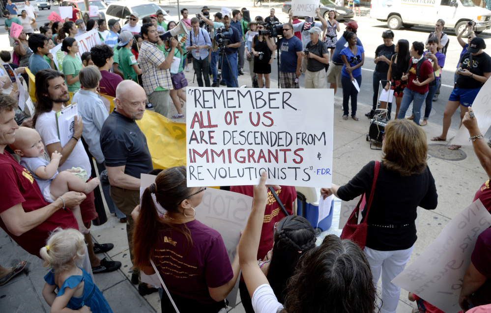 Pro-immigrant activists participate in a counter-protest against a group of tea party members staging a rally against the surge in illegal immigration on July 18 in Philadelphia, Pa. 