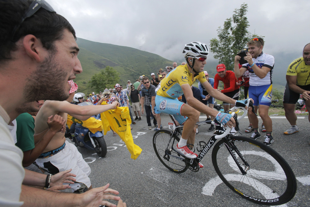 Stage winner Vincenzo Nibali of Italy climbs towards Hautacam after breaking away from his rivals during the eighteenth stage of the Tour de France cycling race over 145.5 kilometers (90.4 miles) with start in Pau and finish in Hautacam, Pyrenees region, France.