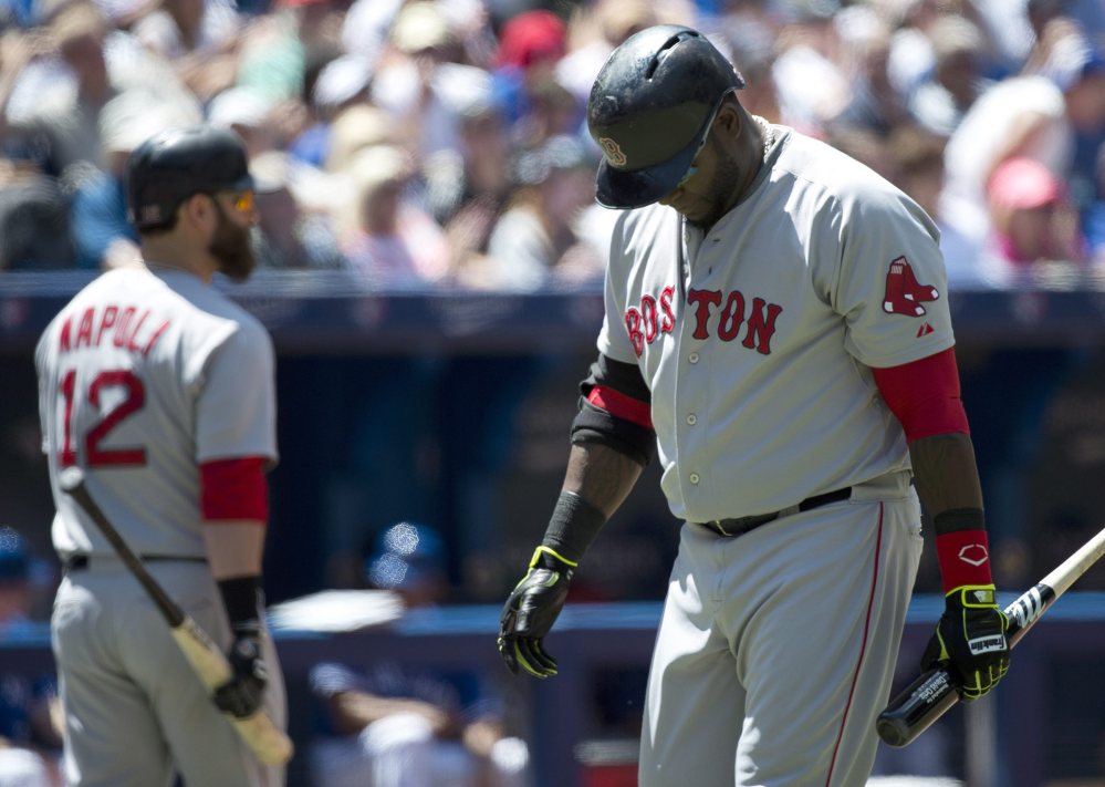 Boston Red Sox designated hitter David Ortiz looks down and makes his way back to the dugout after striking out against the Toronto Blue Jays in the fourth inning of Thursday’s game in Toronto.