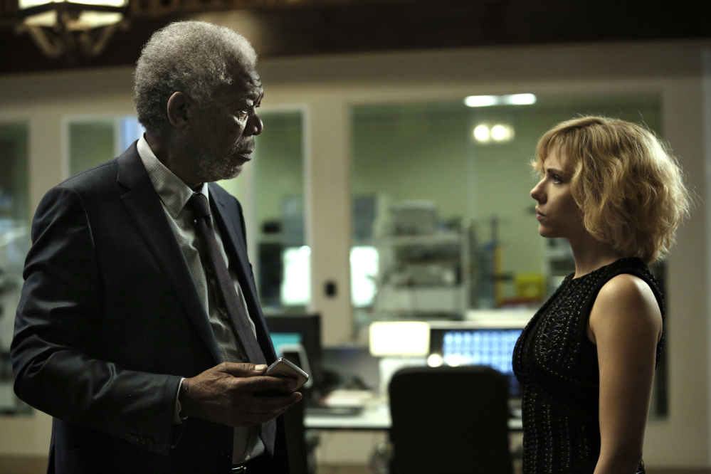 This image released by Universal Pictures shows Morgan Freeman, left, and Scarlett Johansson in a scene from "Lucy." 