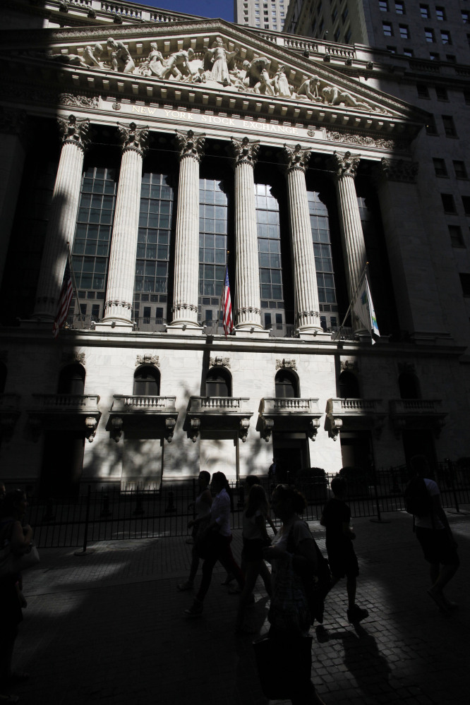 The New York Stock Exchange is shown. European stock markets were down Friday, while Asian markets took cheer from U.S. unemployment claims falling to an eight-year low.