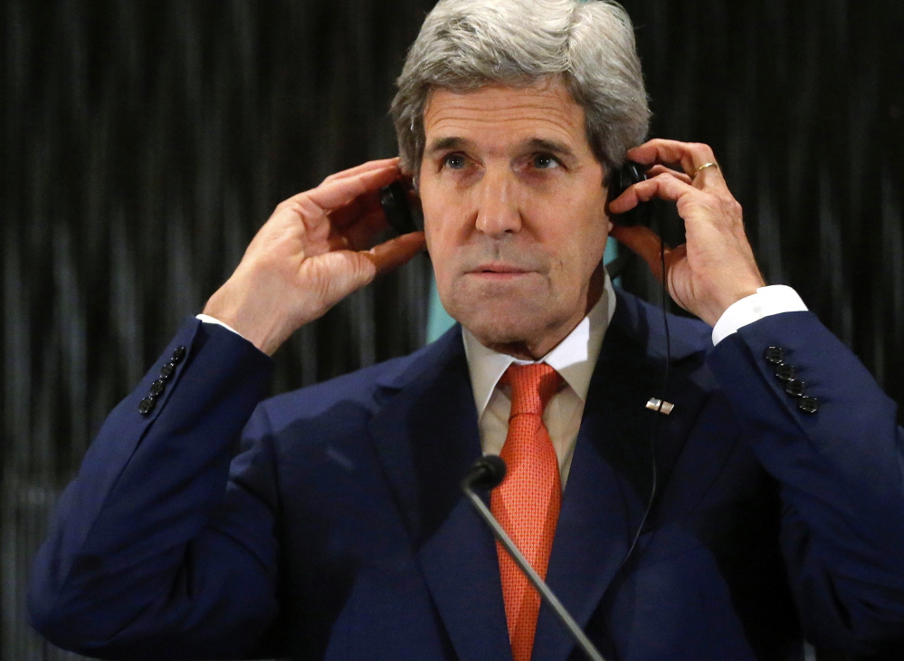 U.S. Secretary of State John Kerry listens to remarks Friday at a hotel in Cairo. The lull in fighting will allow civilians to receive aid and evacuate to safer areas, a spokesman for Hamas says.
