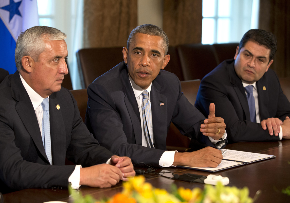 Guatemala’s President Otto Perez Molina, left, and Honduran President Juan Hernandez, right, listen as President Obama speaks to the media about immigration and the border crisis, at the White House on Friday.