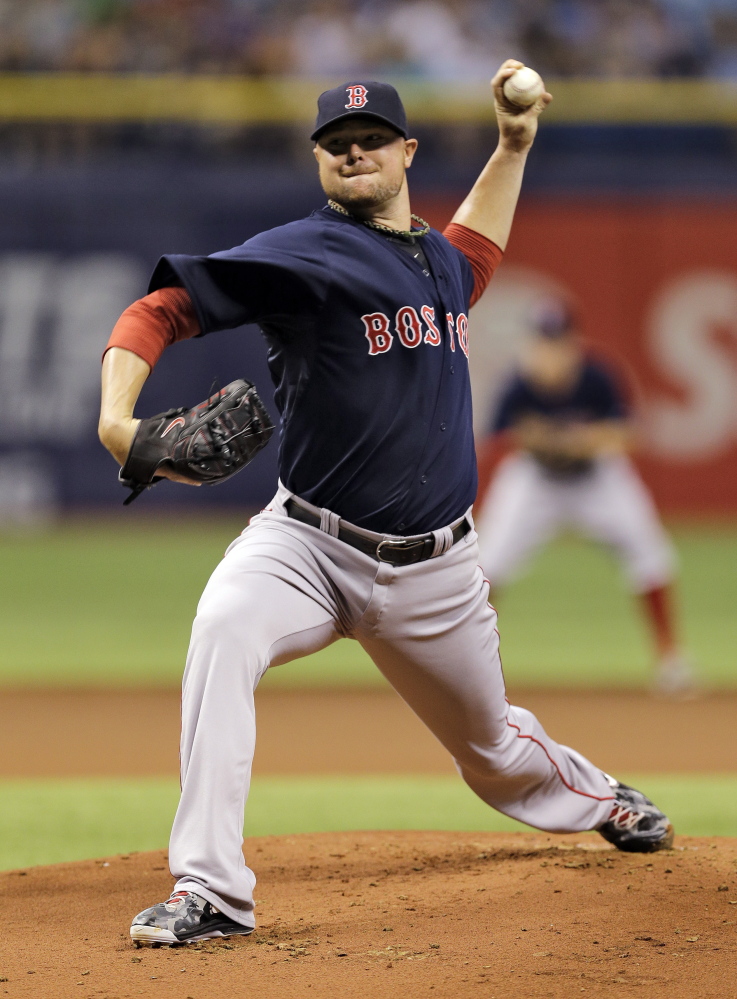 Red Sox starting pitcher Jon Lester delivers to the Tampa Bay Rays in the first inning Friday.