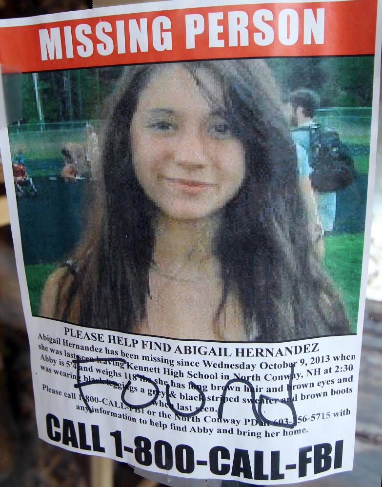 In this file photo taken Tuesday July 22, a missing person poster of Abigail Hernandez displayed in a storefront window in North Conway, N.H., shows Hernandez has been found.