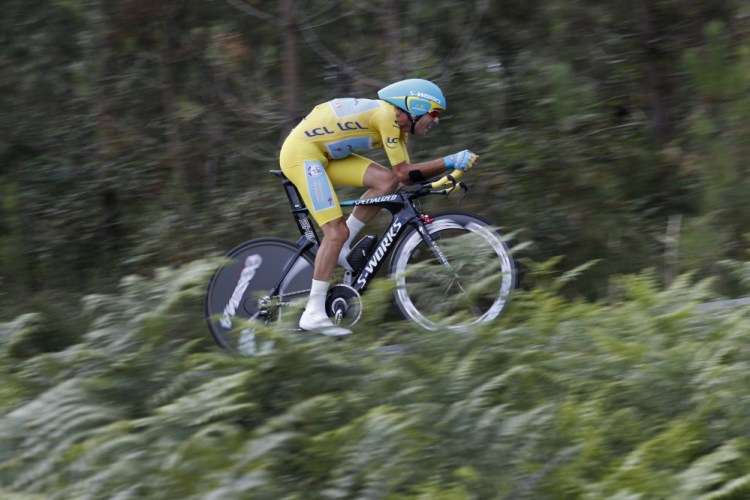 Italy’s Vincenzo Nibali, wearing the overall leader’s yellow jersey, strains during the 20th stage of the Tour de France cycling race, an individual time-trial over 54 kilometers (33.6 miles) with start in Bergerac and finish in Perigueux, France, Saturday.