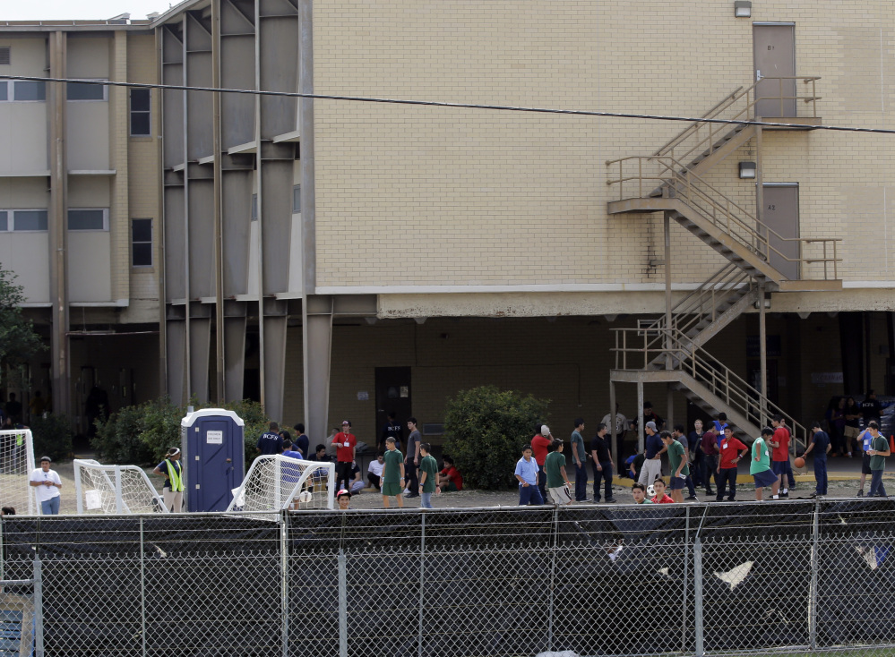 Unaccompanied minors who have entered the country illegally are being held at temporary shelters such as this one at Lackland Air Force Base in Texas. With Congress about to recess, chances for a long-term solution seem improbable.