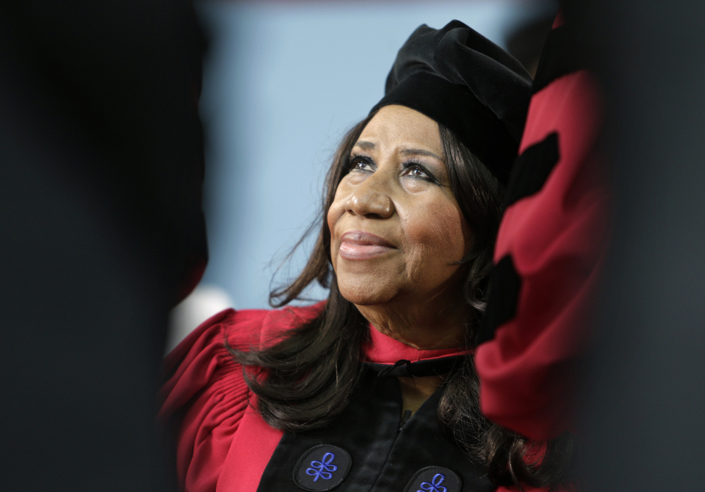 Singer Aretha Franklin looks up while seated on stage during Harvard University’s commencement ceremonies in Cambridge, Mass., where she was presented an honorary Doctor of Arts degree on May 29, 2014. 