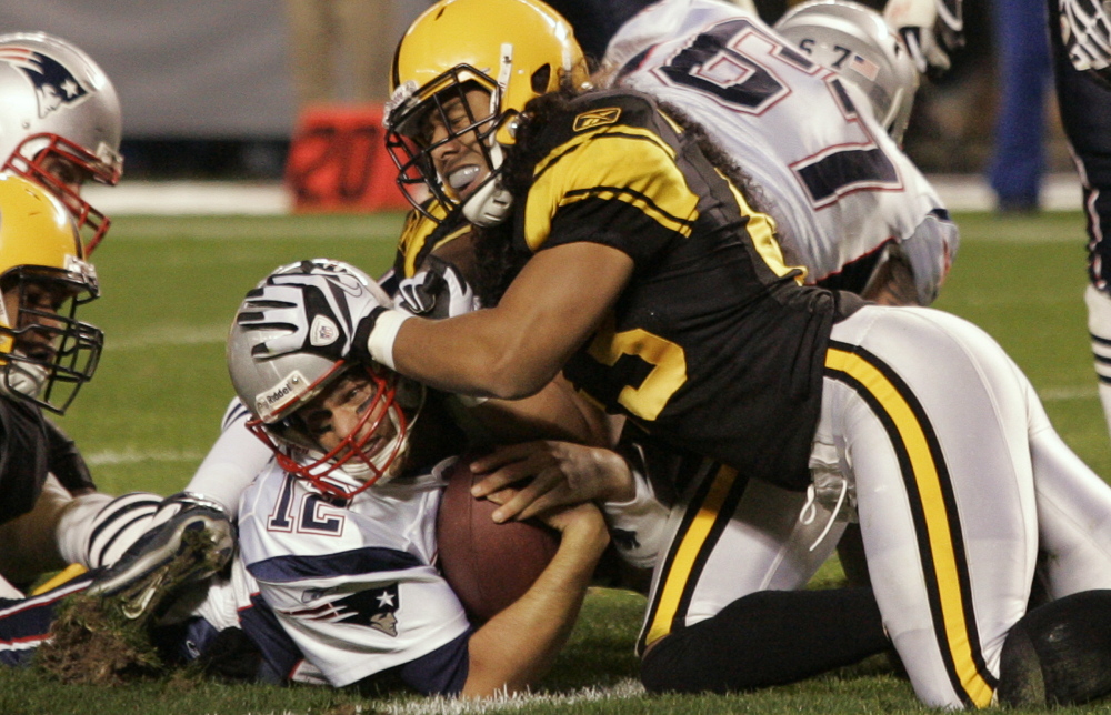 Tom Brady took hits in 2010, like this one from Troy Polamalu.