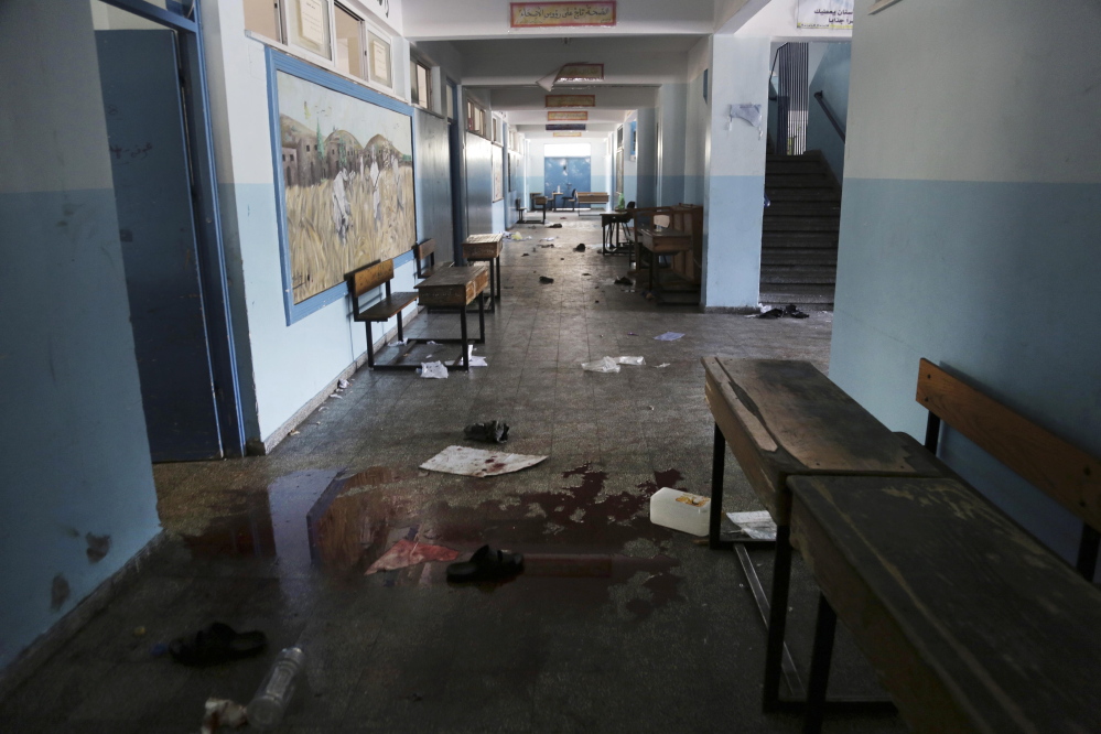 Blood and discarded belongings are seen in a corridor at a U.N. school in Beit Hanoun in the northern Gaza Strip on Thursday. Israel says its forces are not responsible for the deaths of the Palestinians who were sheltering in the school when it was shelled.
