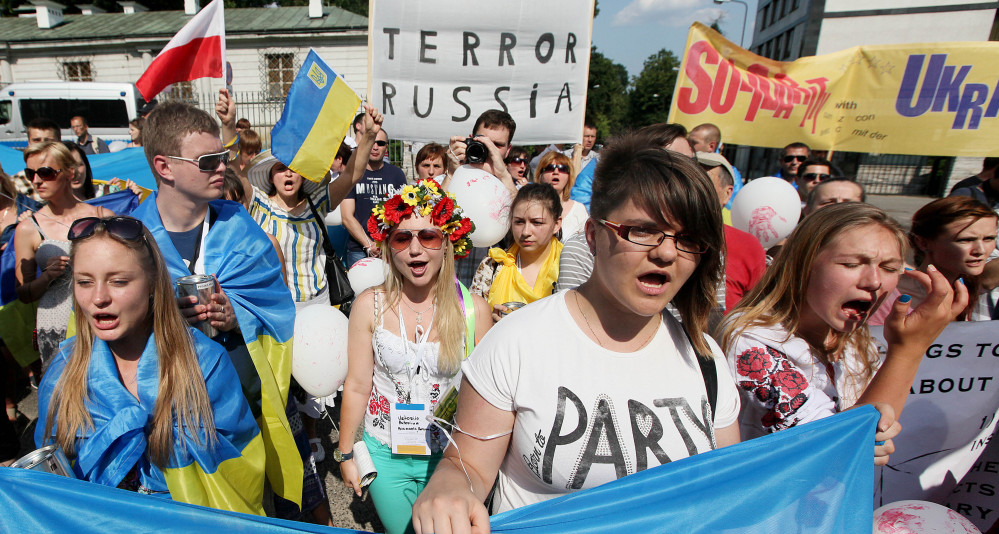 About 250 people protest against Russia’s behavior  in the Ukraine conflict in Warsaw, Poland, on Sunday.