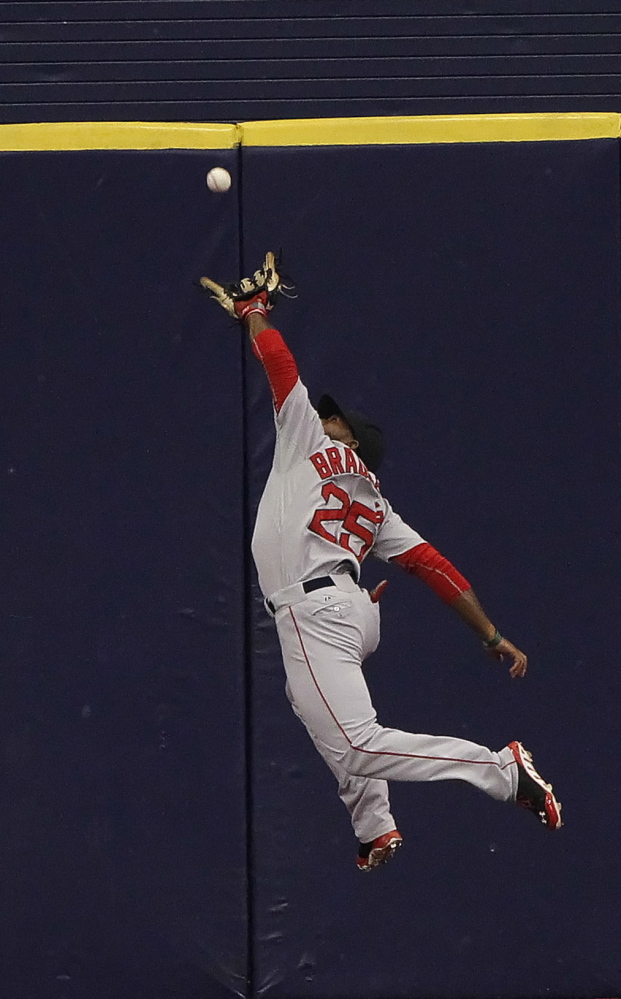 Red Sox center fielder Jackie Bradley Jr. makes a leaping catch on a drive by Tampa Bay’s Evan Longoria in the sixth inning, helping Boston end a five-game losing streak.
