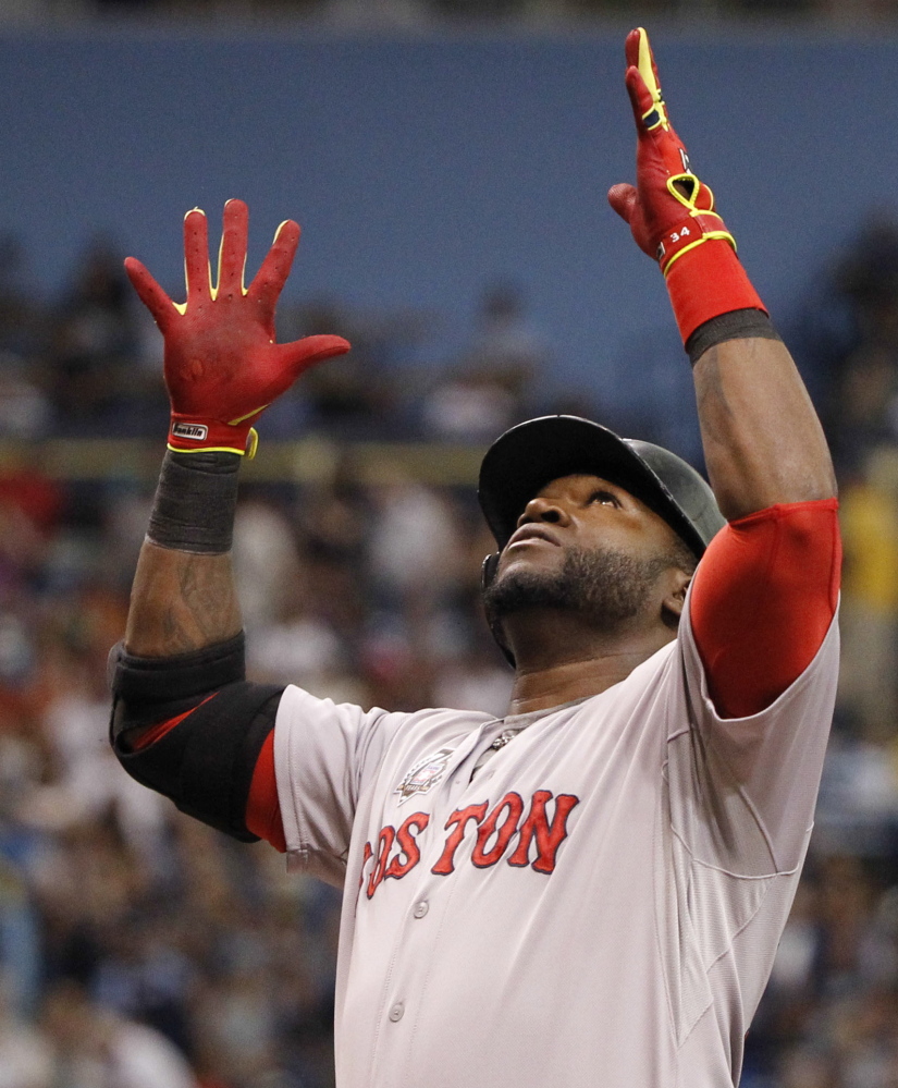 David Ortiz celebrates after hitting a three-run homer in the third inning Sunday, starting the Red Sox on their way to a 3-2 win.