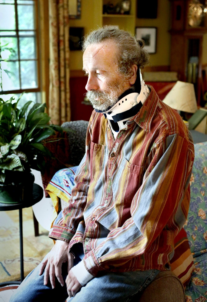 About a month after he was attacked by a polar bear in Canada, Matt Dyer recounts the ordeal in August 2013 while wearing a neck brace at his home in Turner.