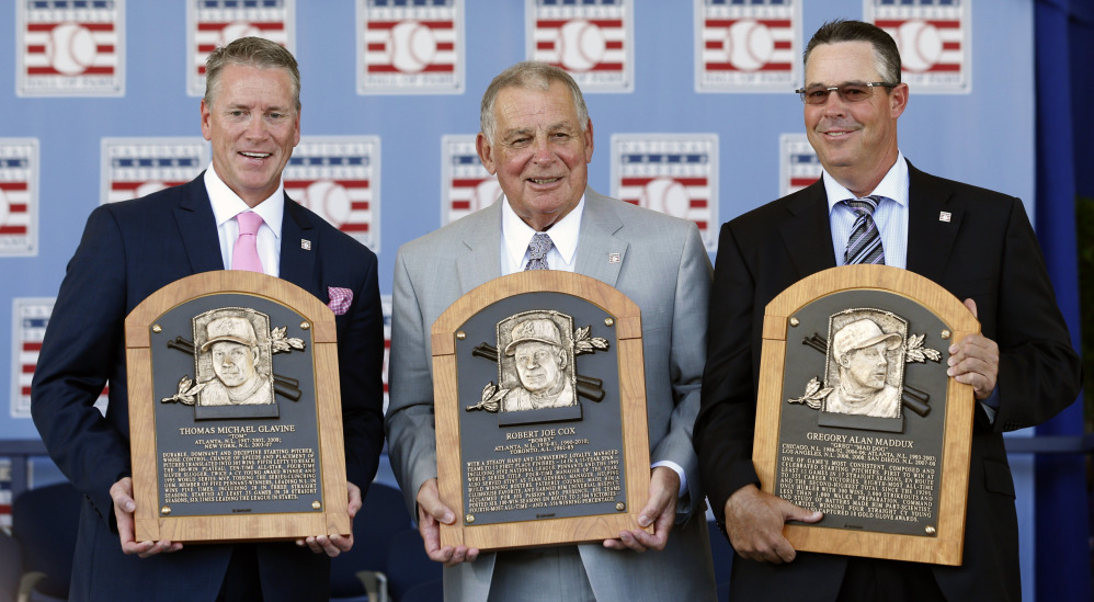It was a reunion of Atlanta Braves greats as pitchers Tom Glavine, left, and Greg Maddux, right, along with their manager, Bobby Cox, were inducted into the baseball Hall of Fame on Sunday in Cooperstown, N.Y.
