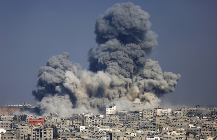 Smoke from the explosion of an Israeli strike rise over Gaza City, Tuesday.